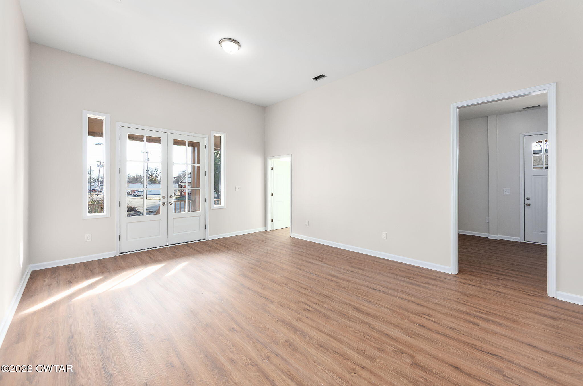 200 Lambuth Boulevard Jackson, TN 38301 - Photo 12 of 28 an empty room with wooden floor and windows