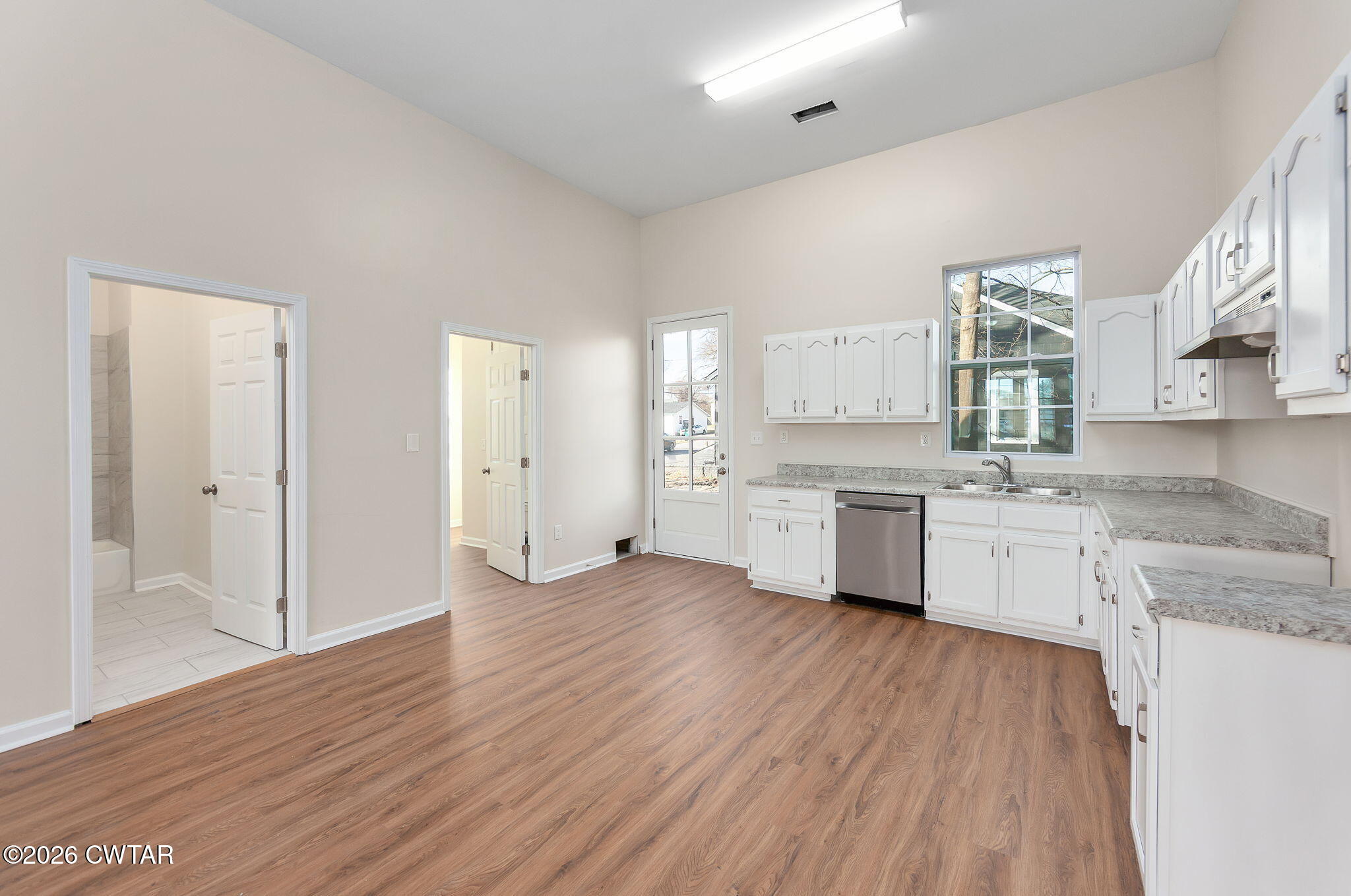 200 Lambuth Boulevard Jackson, TN 38301 - Photo 13 of 28 a view of a kitchen with wooden floor and electronic appliances