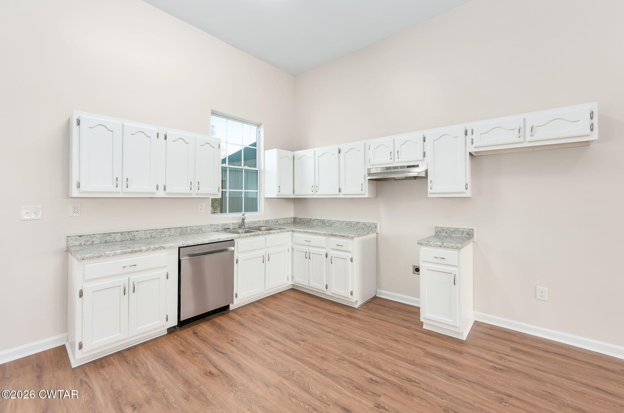 200 Lambuth Boulevard Jackson, TN 38301 - Photo 14 of 28 a kitchen with granite countertop white cabinets and wooden floor