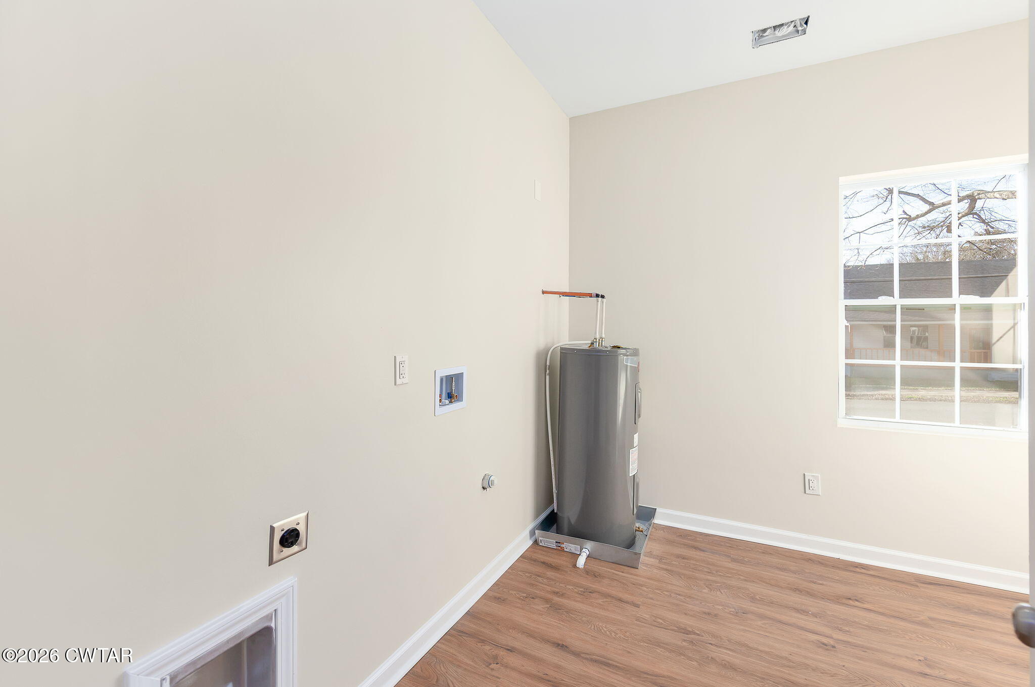 200 Lambuth Boulevard Jackson, TN 38301 - Photo 16 of 28 a view of an empty room with wooden floor and a window
