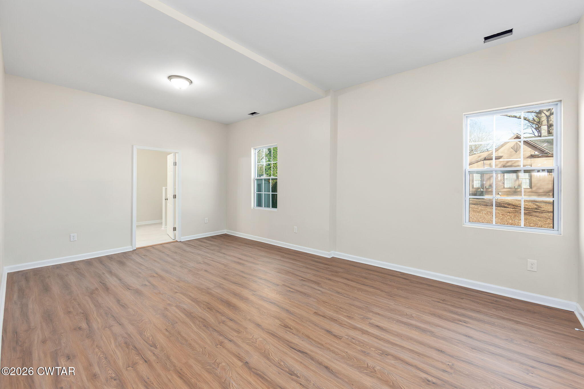 200 Lambuth Boulevard Jackson, TN 38301 - Photo 17 of 28 an empty room with wooden floor and windows