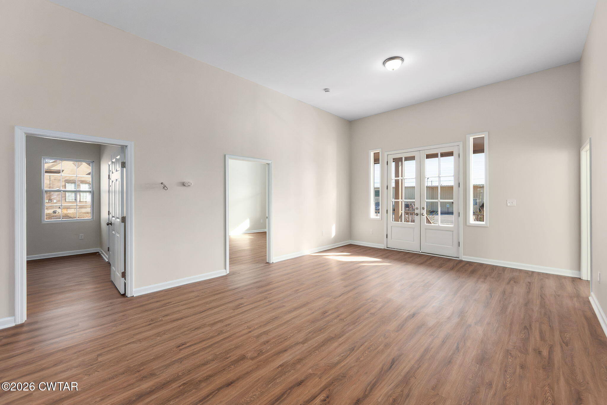 200 Lambuth Boulevard Jackson, TN 38301 - Photo 3 of 28 an empty room with wooden floor and windows