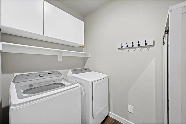 a utility room with dryer and washer