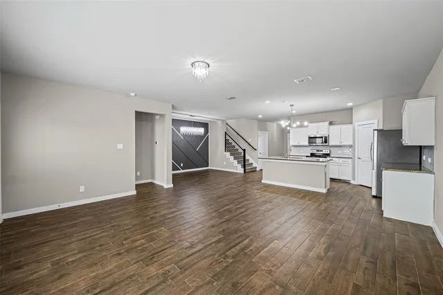 a view of kitchen with wooden floor
