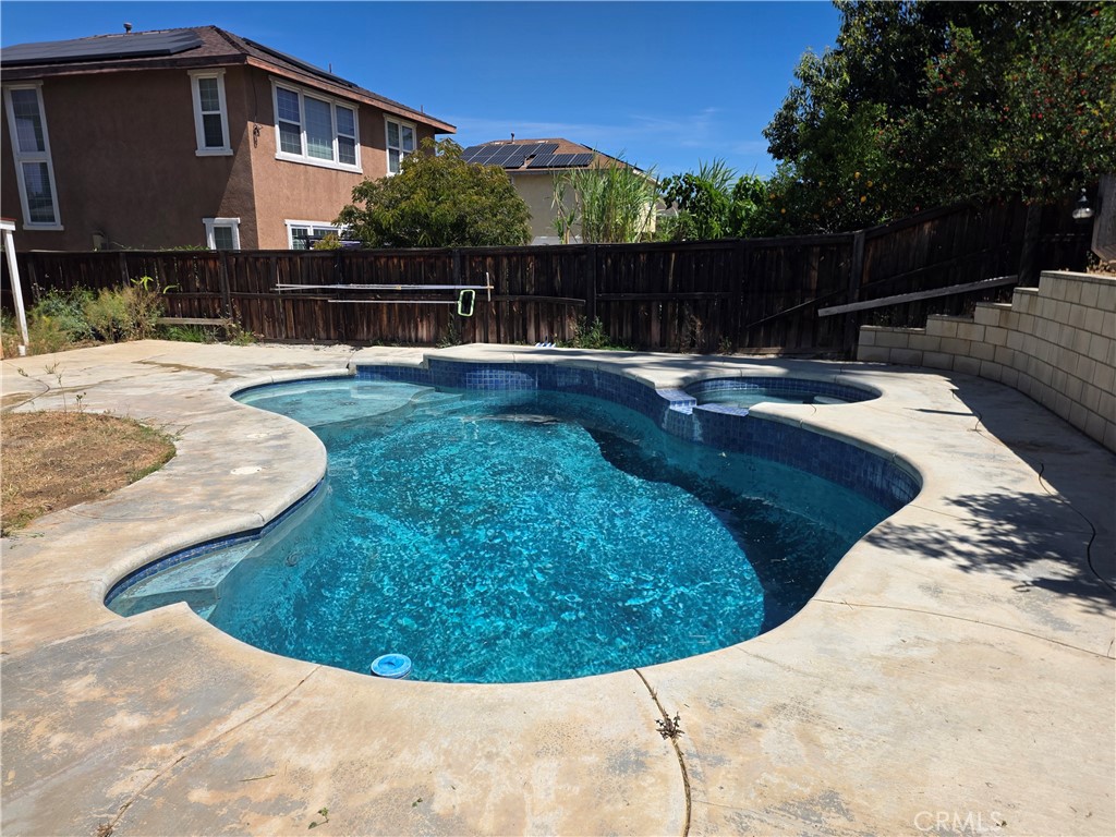 20329 Red Poppy Lane Riverside, CA 92508 - Photo 18 of 24 a view of a swimming pool with a patio