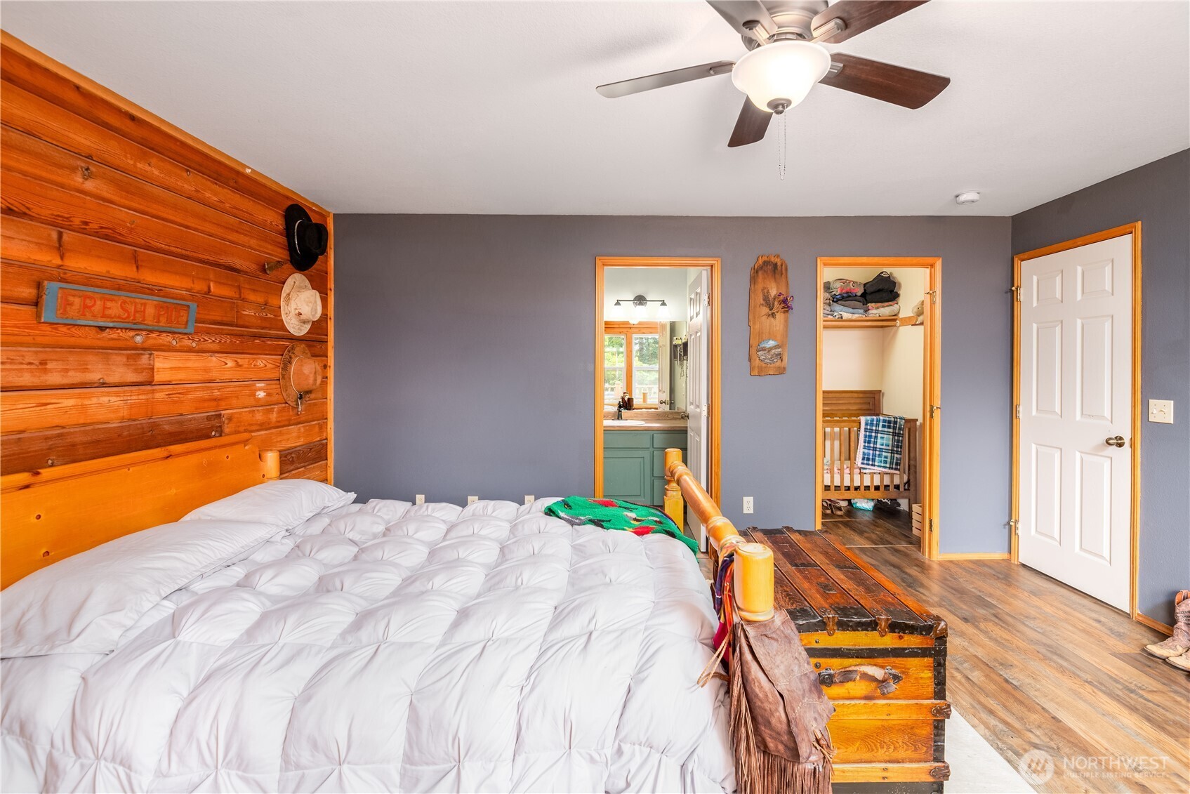 134 Bishop Road Port Angeles, WA 98363 - Photo 21 of 38 a bedroom with a bed and wooden floor