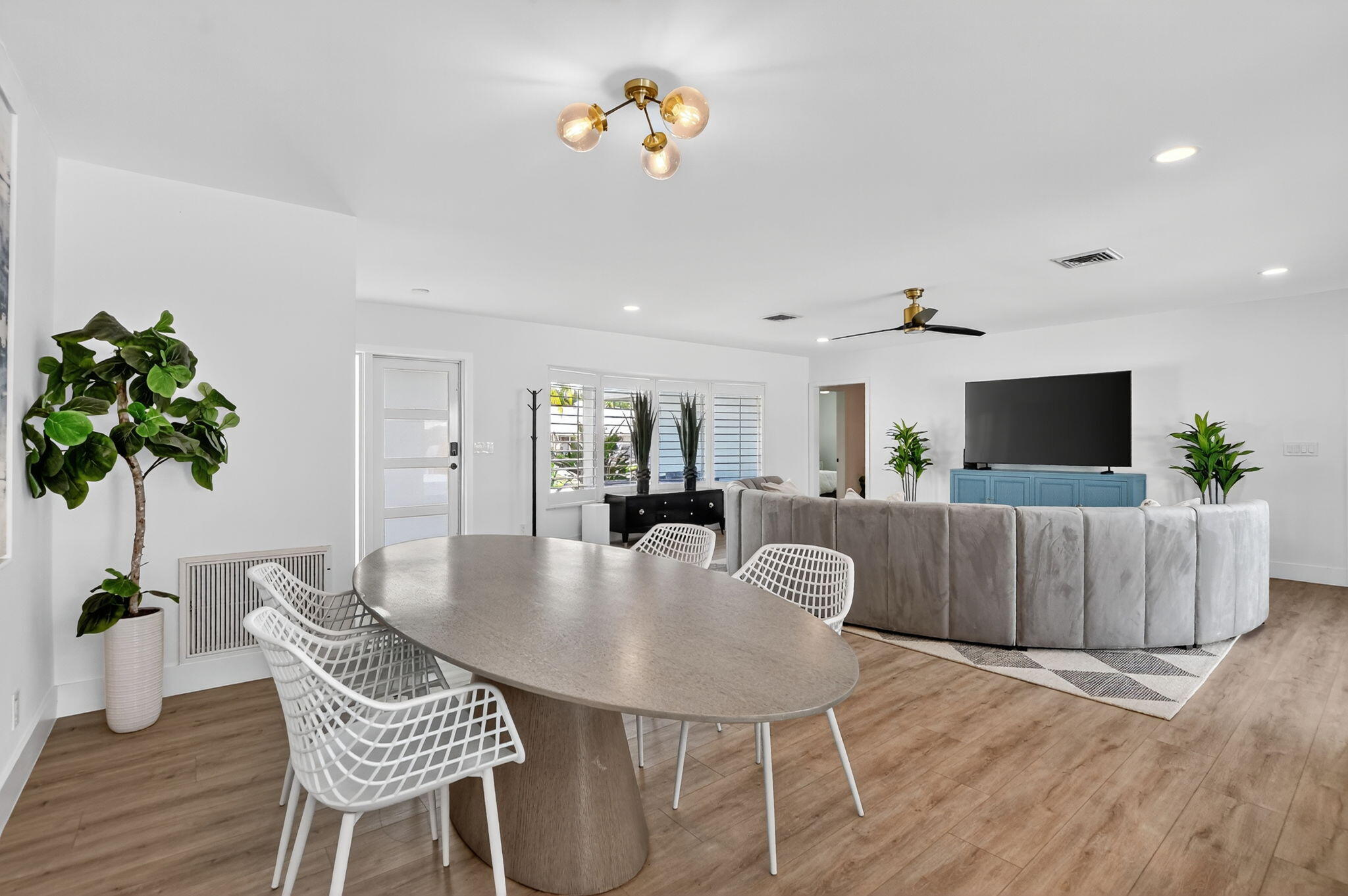 891 Hickory Terrace Boca Raton, FL 33486 - Photo 15 of 56 a dining room with furniture and wooden floor