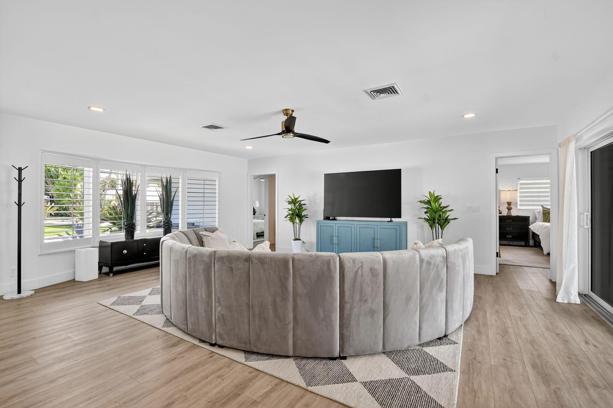 891 Hickory Terrace Boca Raton, FL 33486 - Photo 18 of 56 a living room with furniture and a flat screen tv