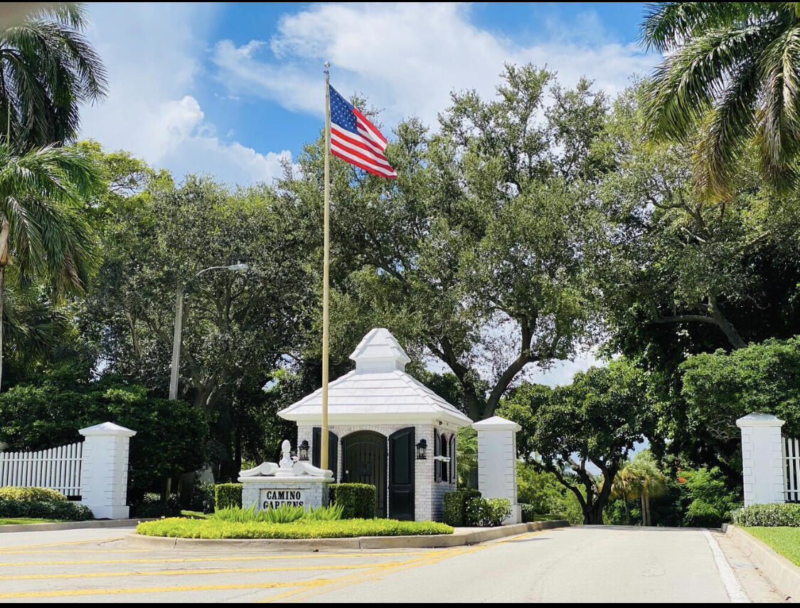 891 Hickory Terrace Boca Raton, FL 33486 - Photo 2 of 56 a front view of a house with a yard and trees