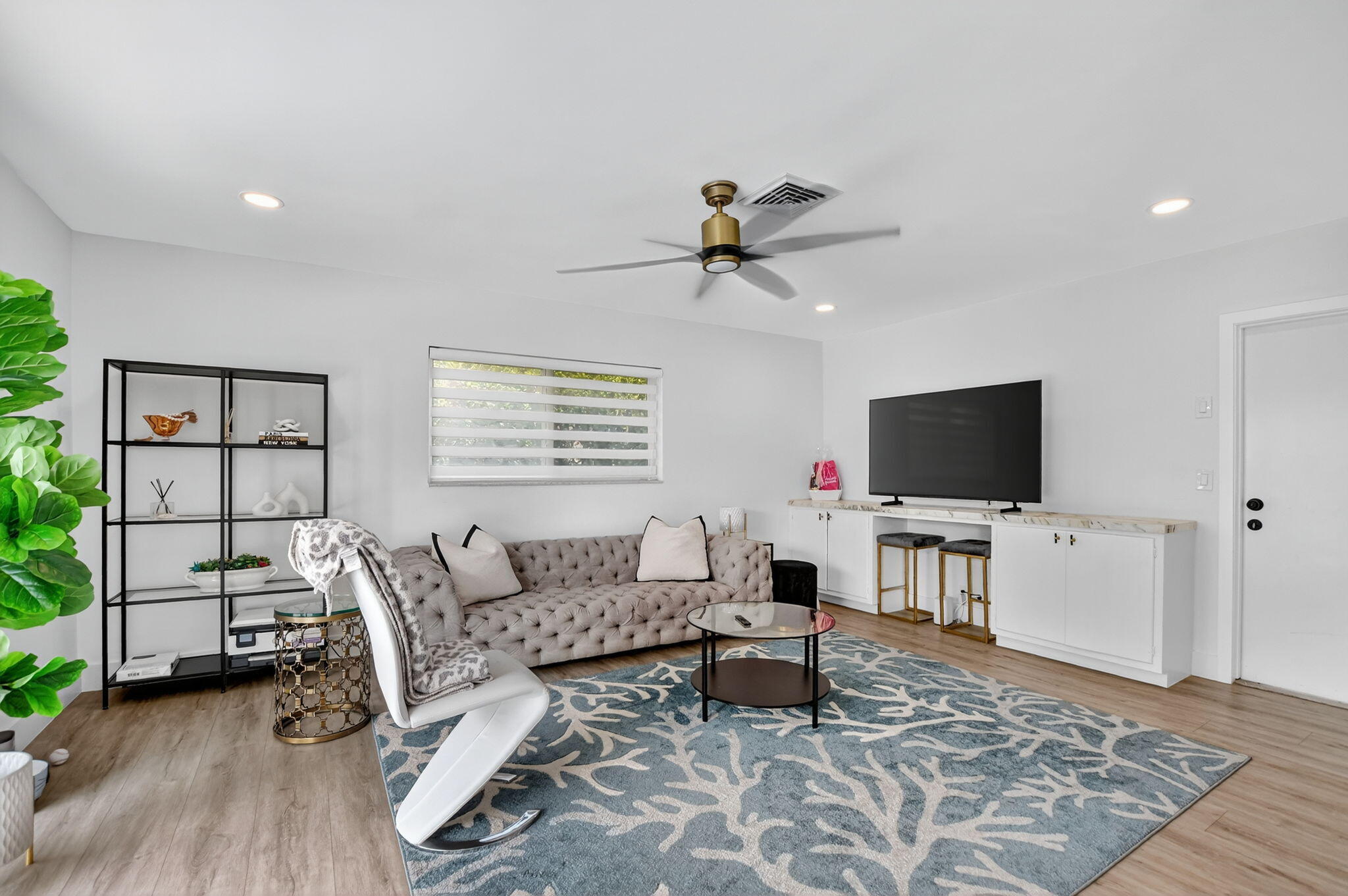 891 Hickory Terrace Boca Raton, FL 33486 - Photo 22 of 56 a living room with furniture and a flat screen tv