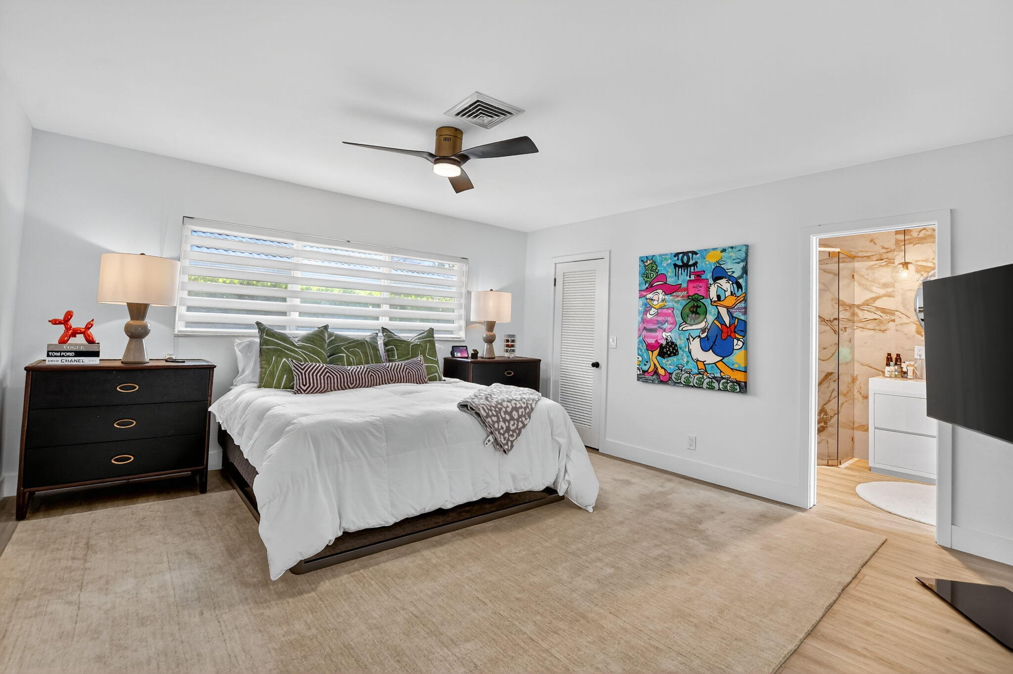 891 Hickory Terrace Boca Raton, FL 33486 - Photo 23 of 56 a bedroom with a bed and a flat screen tv