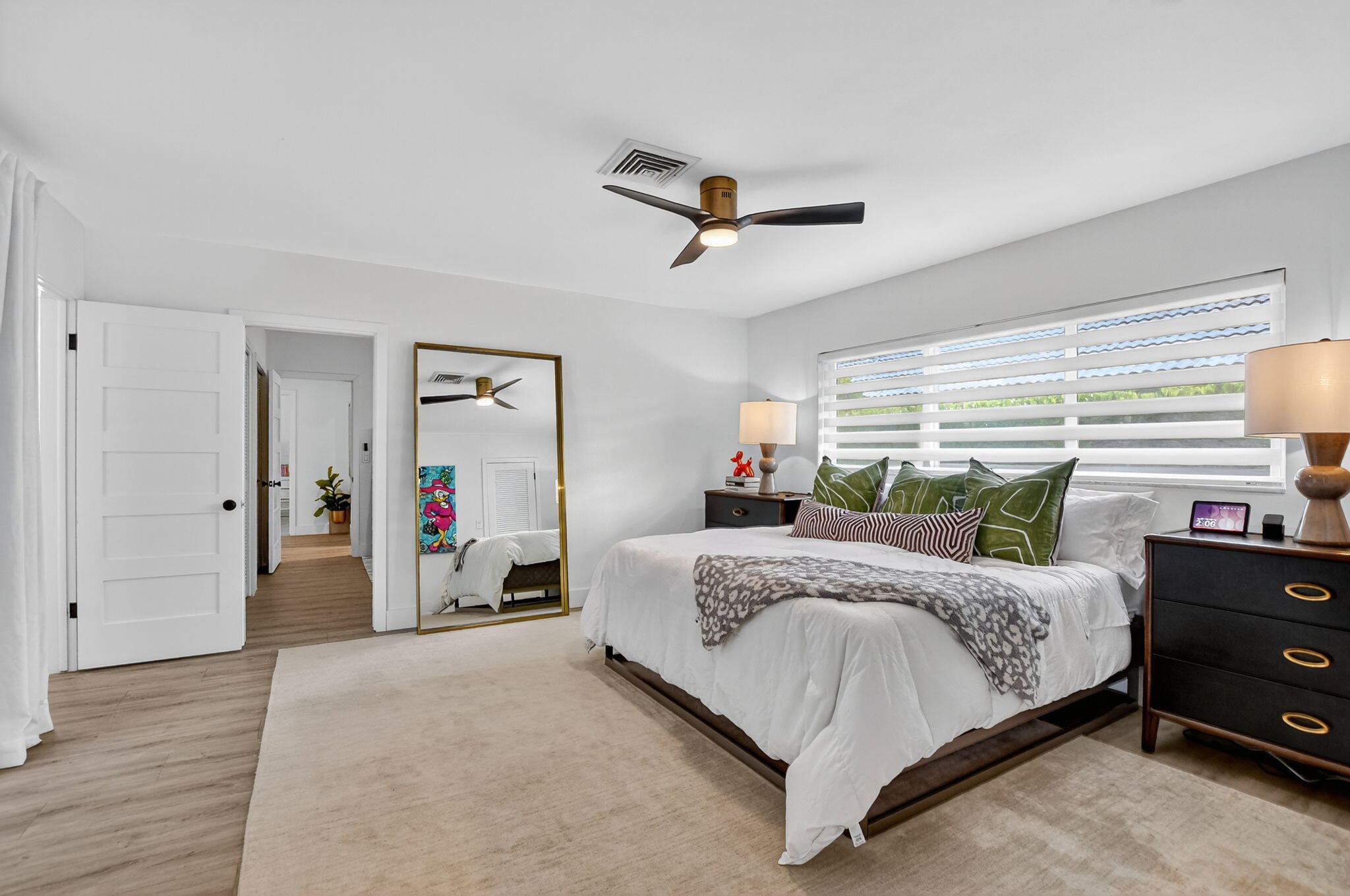 891 Hickory Terrace Boca Raton, FL 33486 - Photo 24 of 56 a bedroom with a bed and a dresser