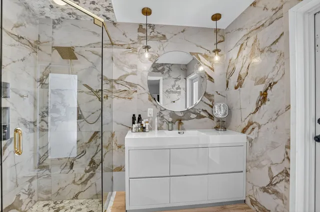 a bathroom with a sink and a shower