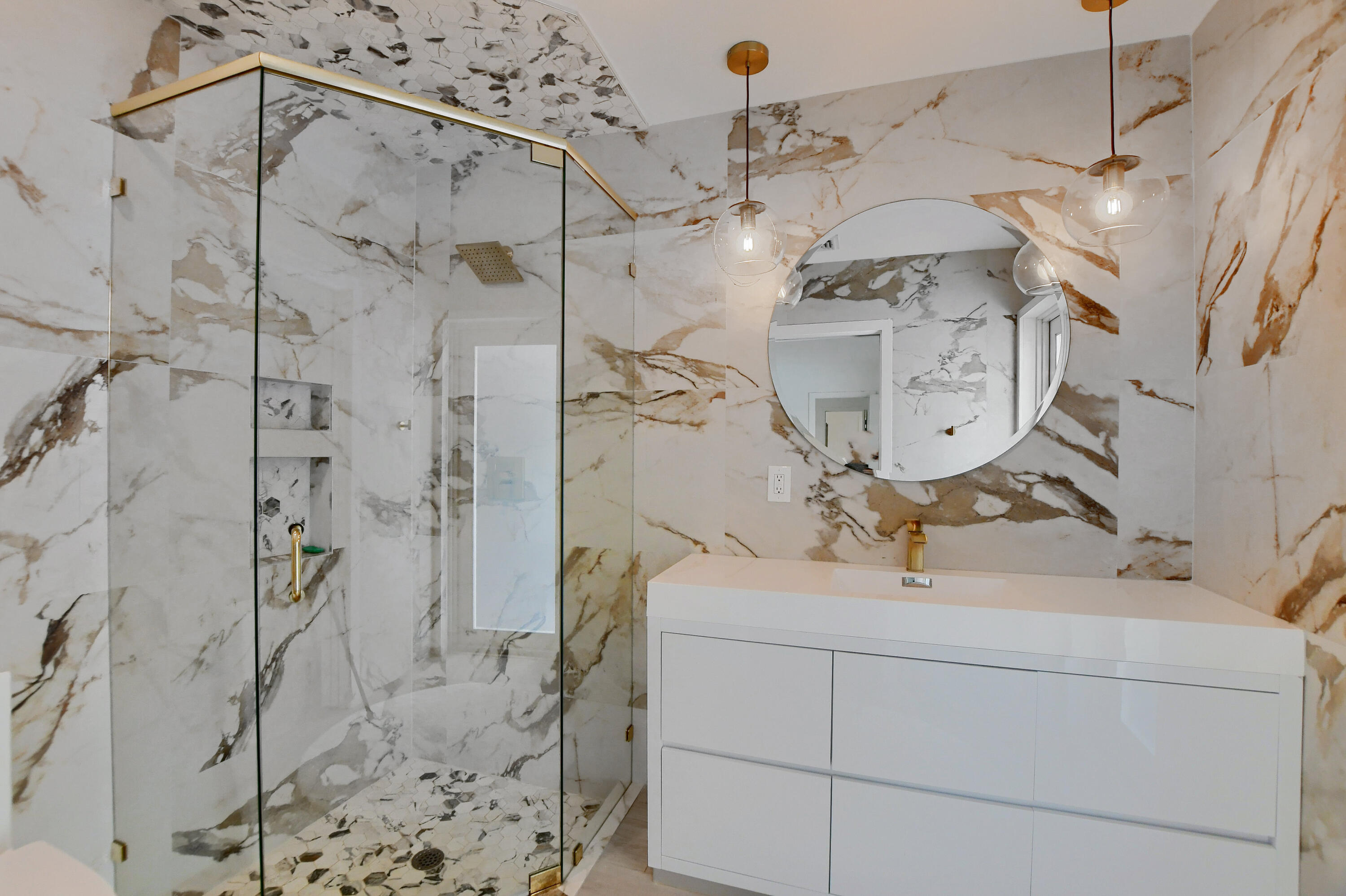891 Hickory Terrace Boca Raton, FL 33486 - Photo 27 of 56 a bathroom with a granite countertop sink a toilet and shower