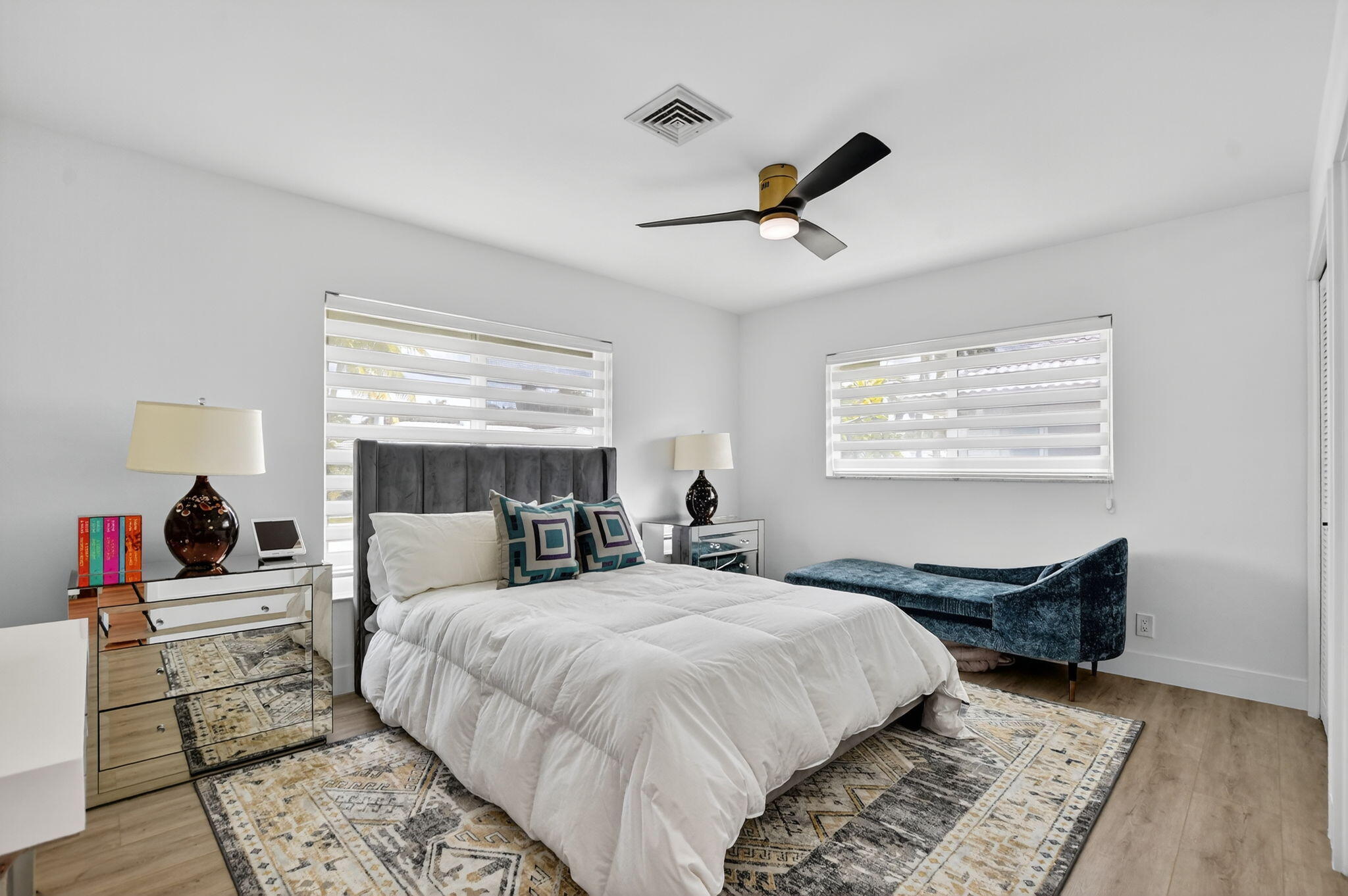 891 Hickory Terrace Boca Raton, FL 33486 - Photo 30 of 56 a bedroom with a bed and wooden floor