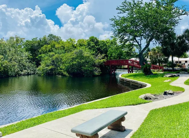 an aerial view of multiple houses with a yard
