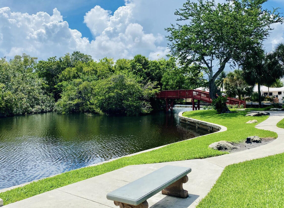 891 Hickory Terrace Boca Raton, FL 33486 - Photo 3 of 56 a view of a lake with a park