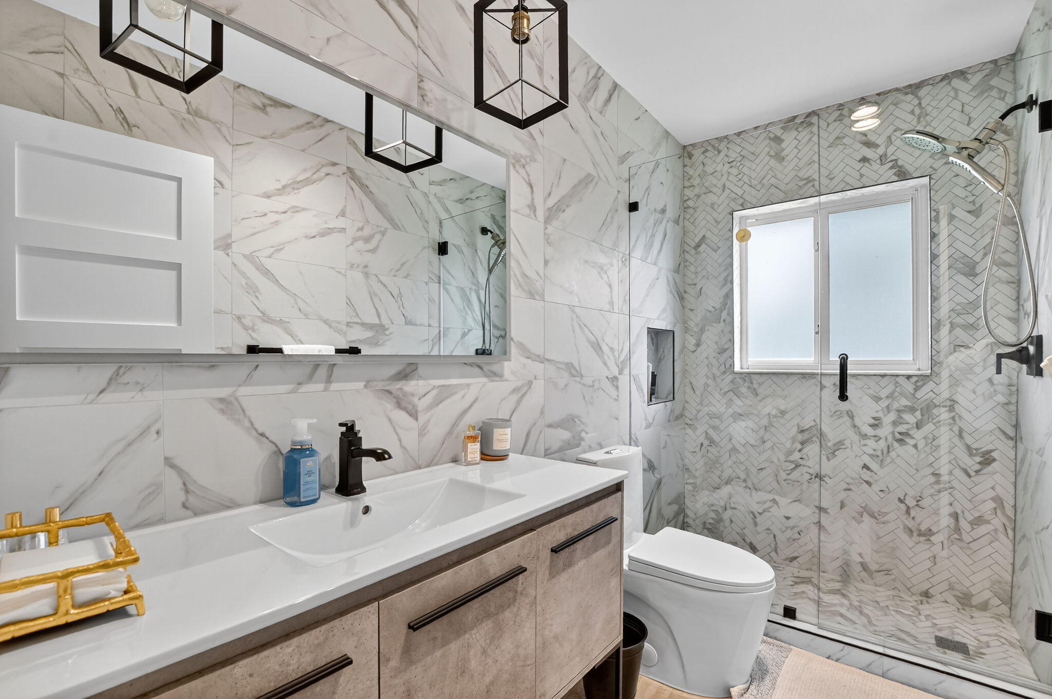 891 Hickory Terrace Boca Raton, FL 33486 - Photo 33 of 56 a bathroom with a sink toilet and shower