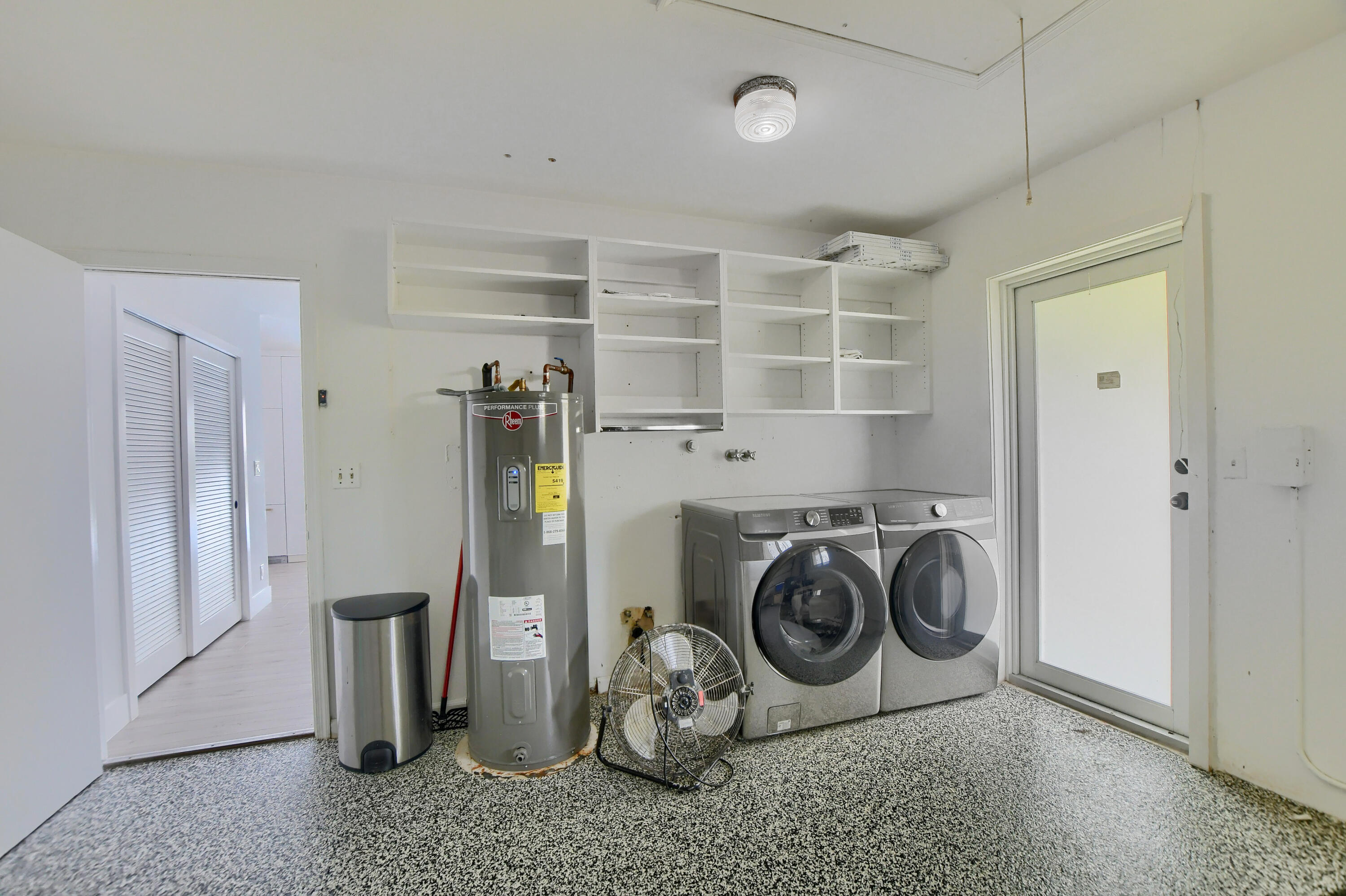 891 Hickory Terrace Boca Raton, FL 33486 - Photo 38 of 56 a utility room with refrigerator washer and dryer