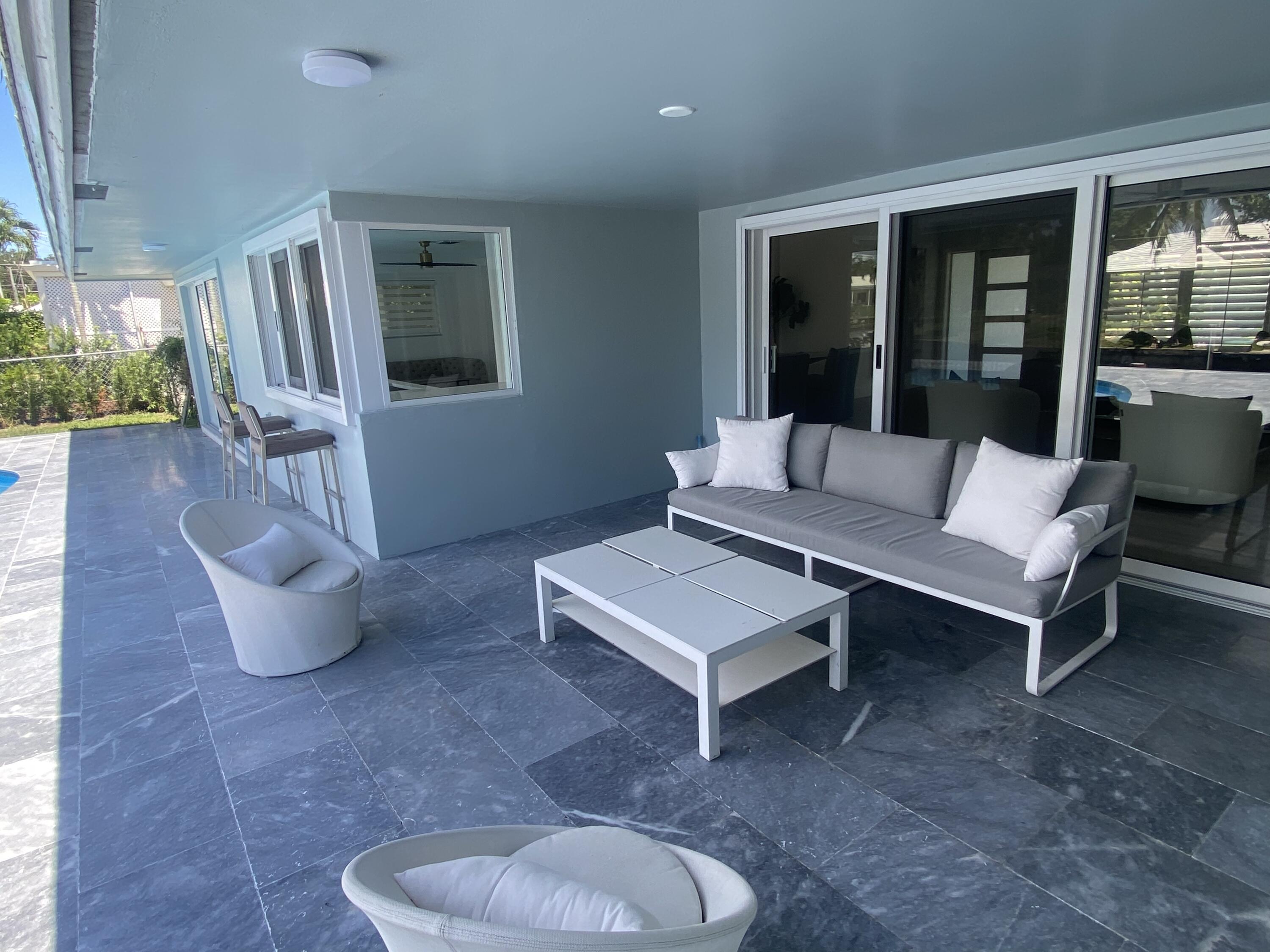 891 Hickory Terrace Boca Raton, FL 33486 - Photo 40 of 56 a living room with furniture and a large window