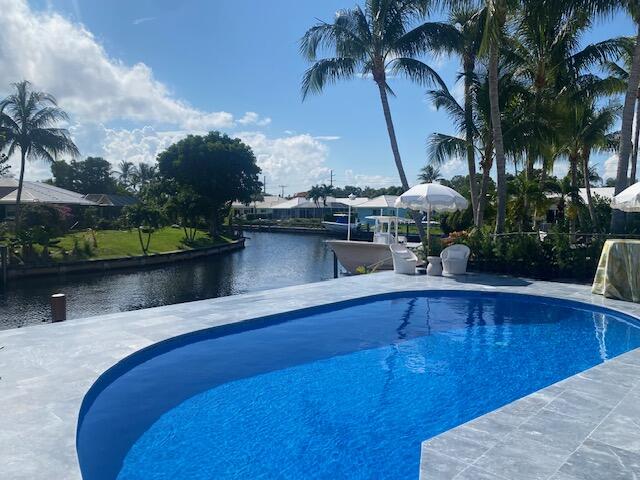 891 Hickory Terrace Boca Raton, FL 33486 - Photo 41 of 56 a view of a swimming pool with a lake view