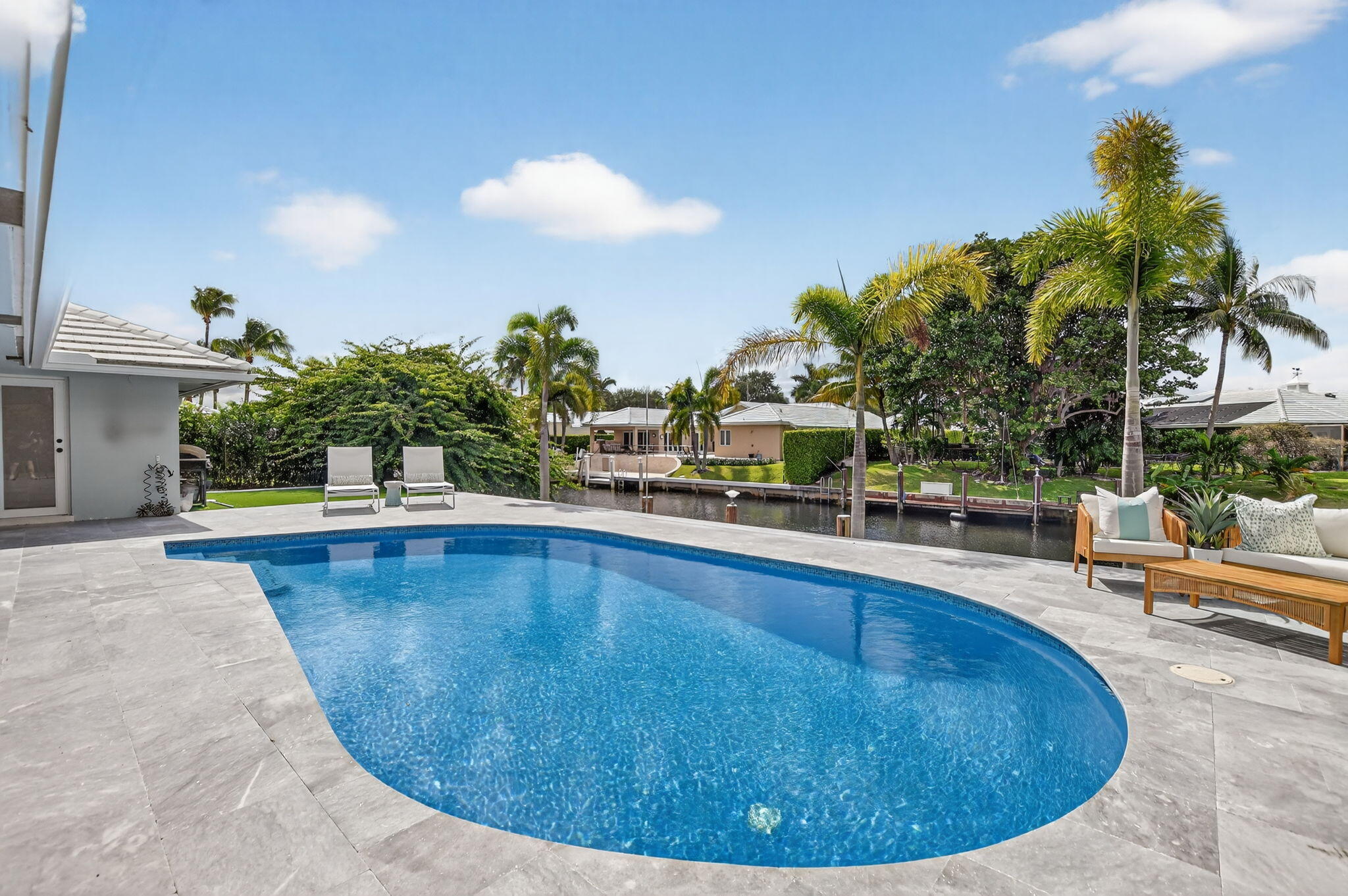 891 Hickory Terrace Boca Raton, FL 33486 - Photo 44 of 56 a view of a swimming pool with sitting area