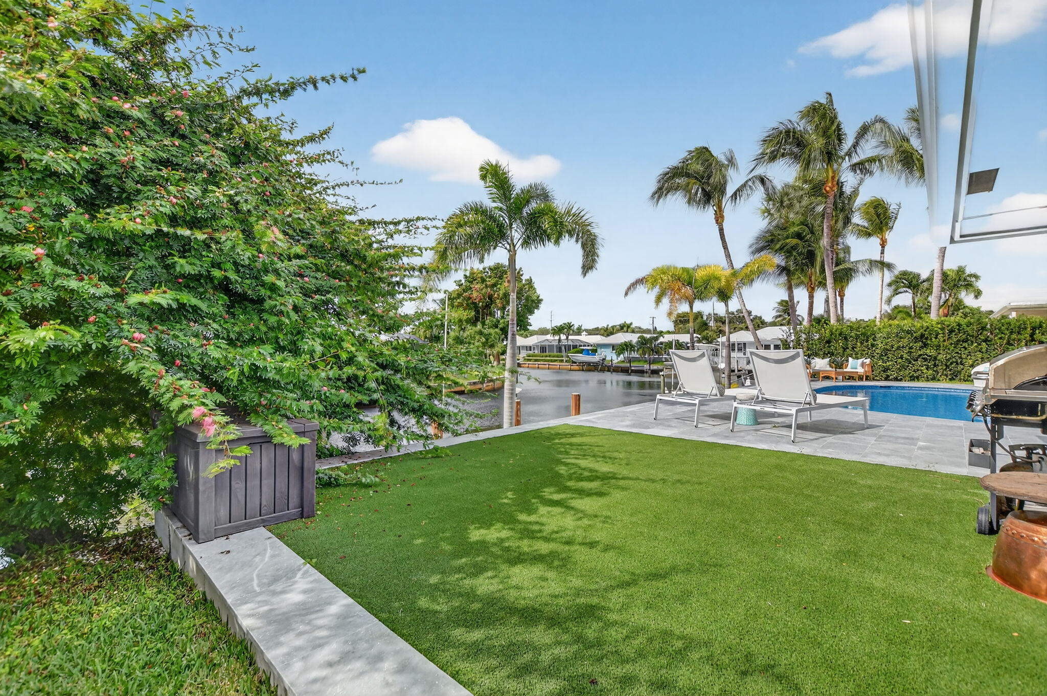 891 Hickory Terrace Boca Raton, FL 33486 - Photo 46 of 56 a view of a backyard with sitting area