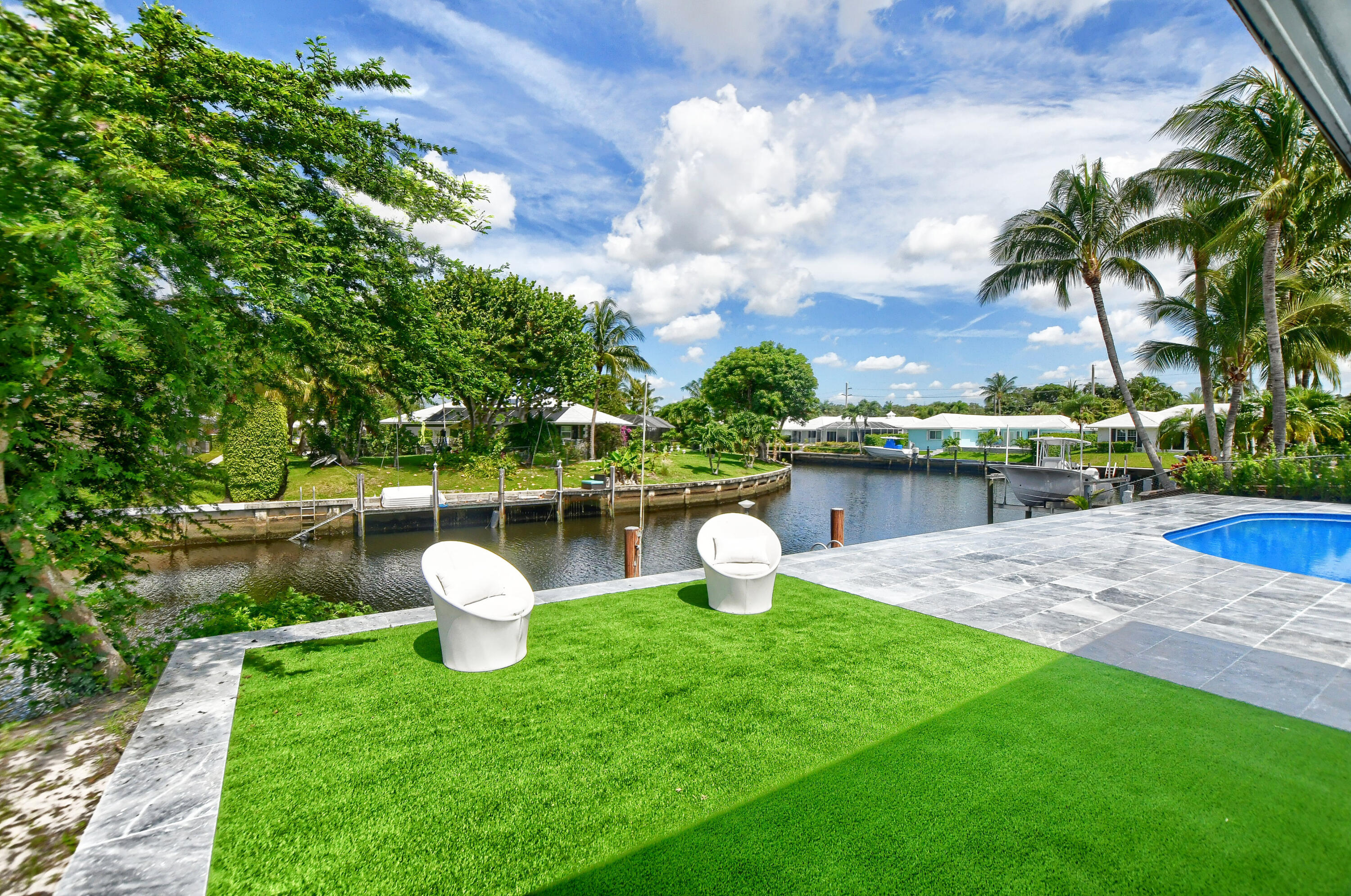 891 Hickory Terrace Boca Raton, FL 33486 - Photo 47 of 56 a view of a lake with a fountain