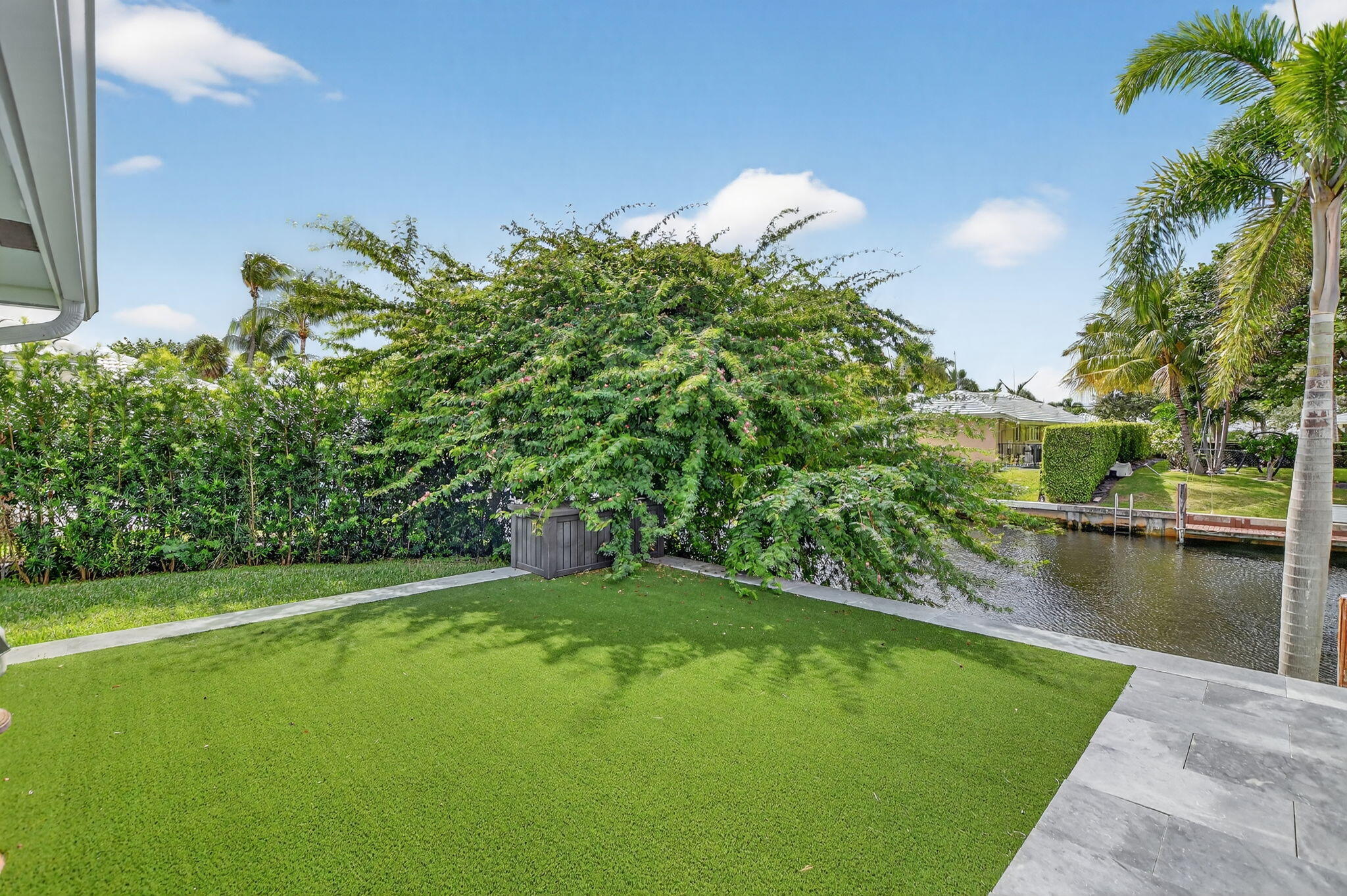 891 Hickory Terrace Boca Raton, FL 33486 - Photo 48 of 56 a view of a lake with a yard