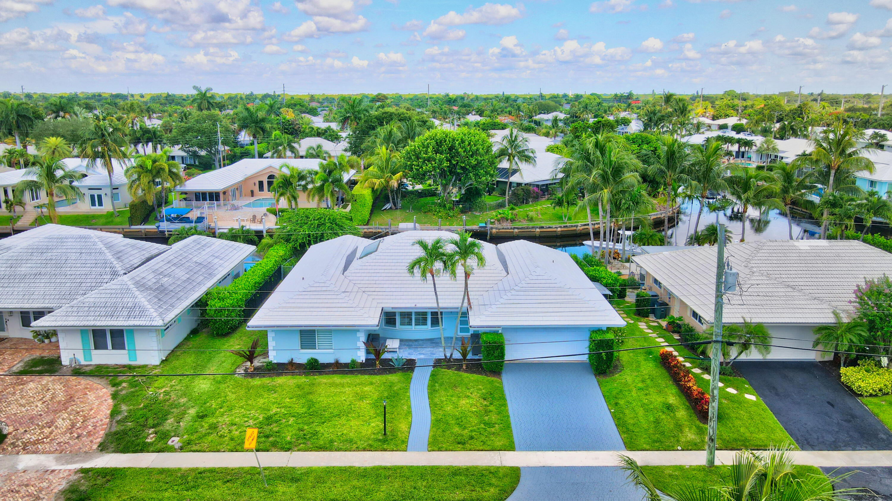 891 Hickory Terrace Boca Raton, FL 33486 - Photo 49 of 56 an aerial view of multiple houses with a yard