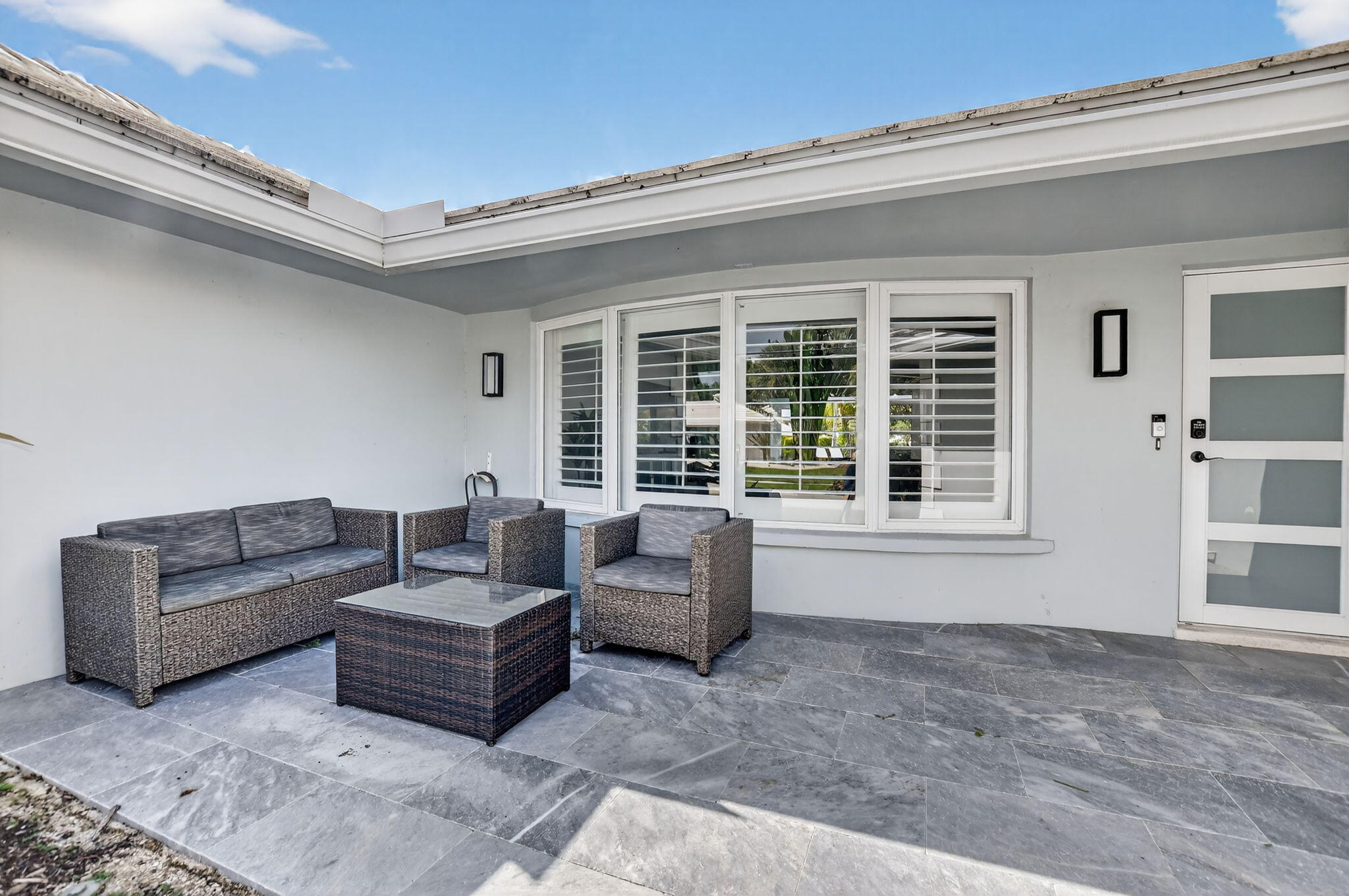 891 Hickory Terrace Boca Raton, FL 33486 - Photo 7 of 56 a living room with furniture and a large window