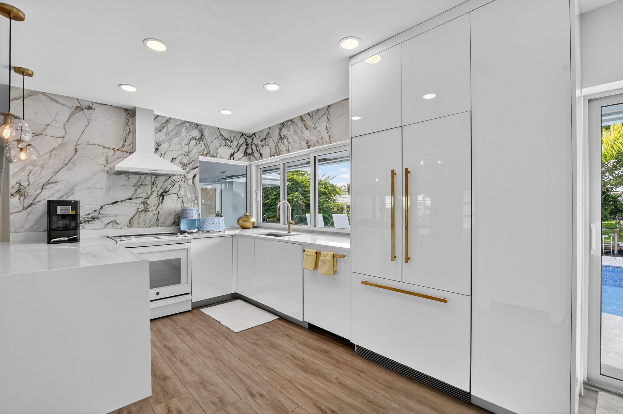 891 Hickory Terrace Boca Raton, FL 33486 - Photo 10 of 56 a kitchen with stainless steel appliances granite countertop a refrigerator and a stove top oven
