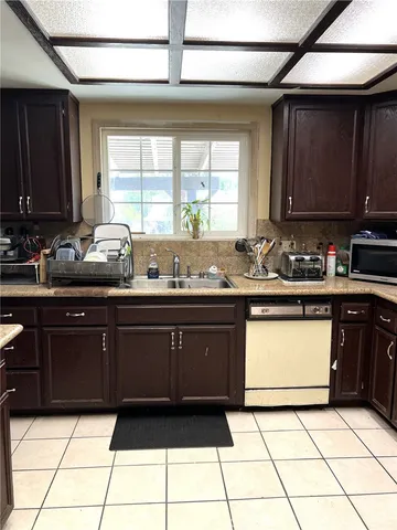 a kitchen with a sink and a stove