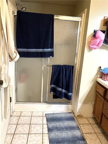 a view of a closet with wooden floor