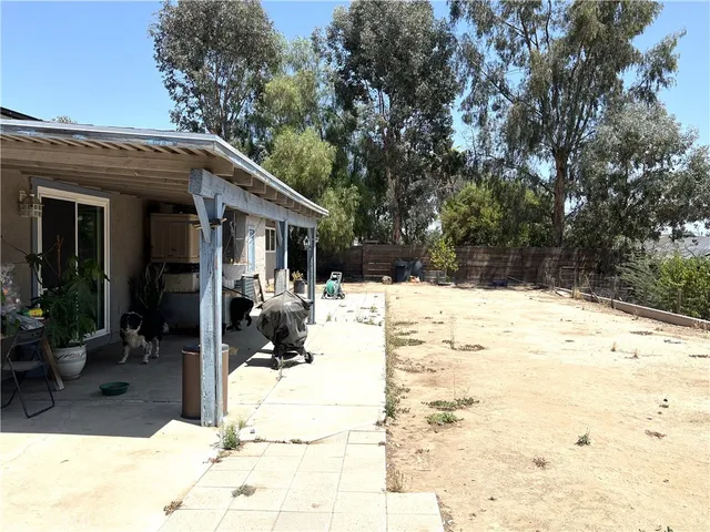 a view of white house with snow on the road