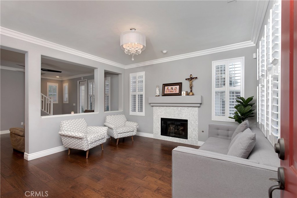 4 Cecil Pasture Road Ladera Ranch, CA 92694 - Photo 1 of 1 a living room with furniture and a fireplace