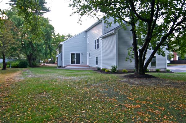 110 Evelyn Road Needham, MA 02494 - Photo 2 of 11 a view of backyard of house with green space