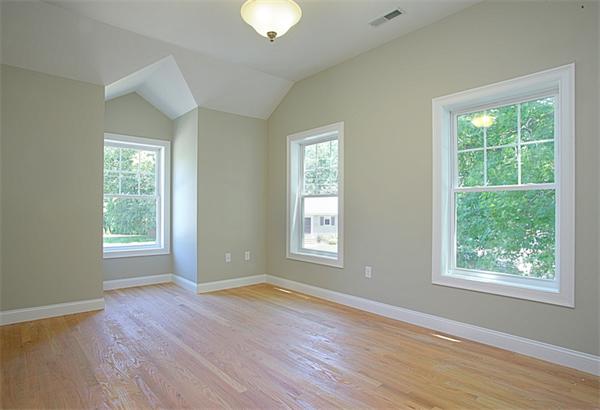 110 Evelyn Road Needham, MA 02494 - Photo 8 of 11 a view of an empty room with wooden floor and a window