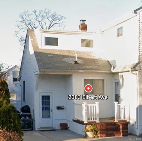a front view of a house with blue lights