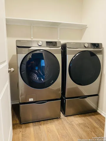 a utility room with dryer and washer