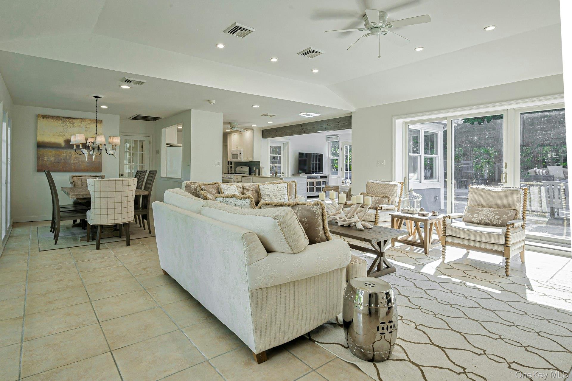 39 Sloop Walk Ocean Beach, NY 11770 - Photo 13 of 46 Spacious living area featuring light tile flooring, recessed lighting, and a ceiling fan