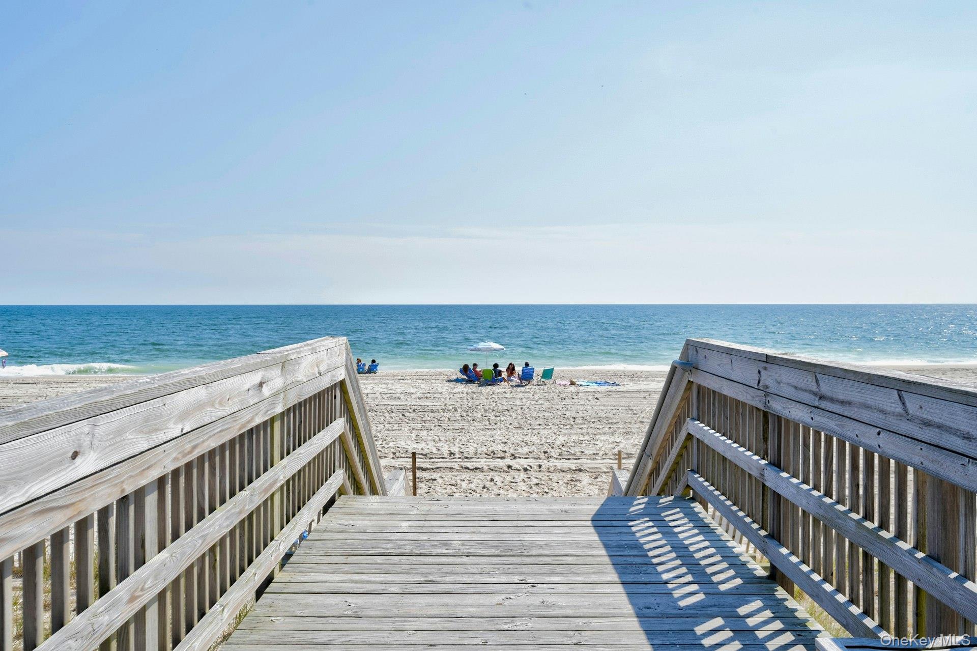 39 Sloop Walk Ocean Beach, NY 11770 - Photo 4 of 46 Wooden boardwalk access leading to a sandy beach