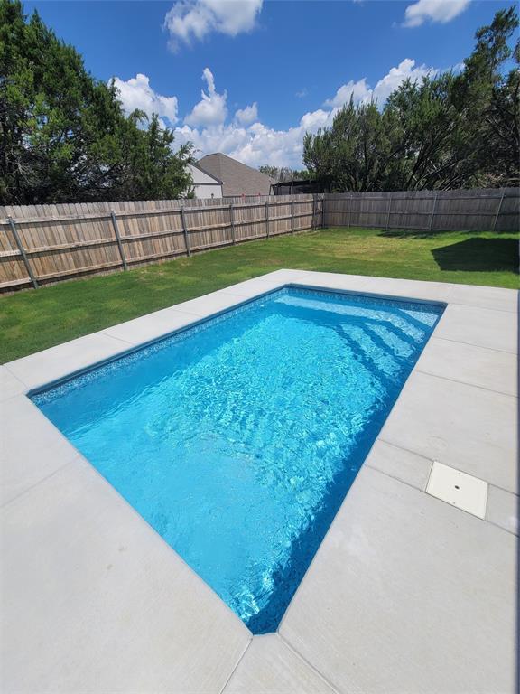 4825 Wichita Street Granbury, TX 76048 - Photo 30 of 30 a view of a backyard with swimming pool