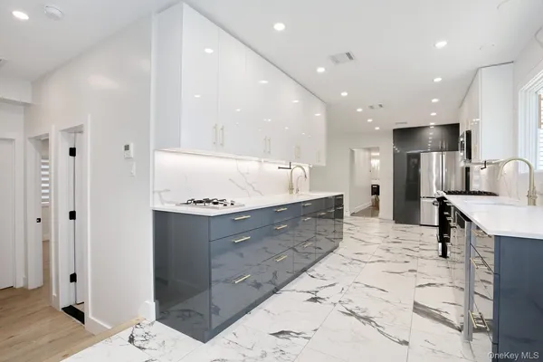 a large bathroom with a large tub shower and sink