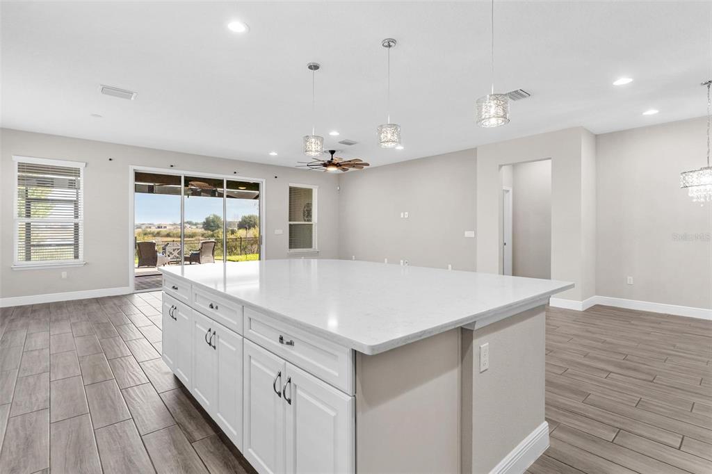 224 Silver Maple Road Groveland, FL 34736 - Photo 19 of 54 a large white kitchen with a sink and dish washer