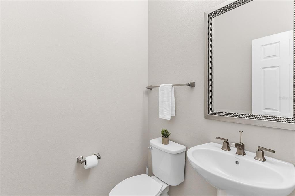 224 Silver Maple Road Groveland, FL 34736 - Photo 23 of 54 a bathroom with a sink mirror and toilet