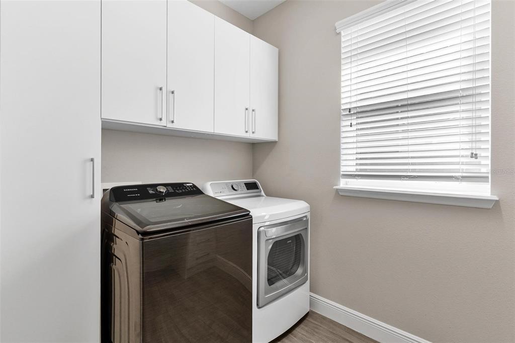 224 Silver Maple Road Groveland, FL 34736 - Photo 24 of 54 a utility room with dryer and washer