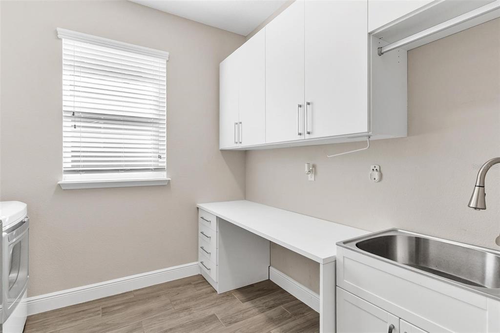 224 Silver Maple Road Groveland, FL 34736 - Photo 25 of 54 a view of cabinets and wooden floor