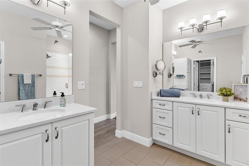 224 Silver Maple Road Groveland, FL 34736 - Photo 29 of 54 a spacious bathroom with a double vanity sink mirror and double