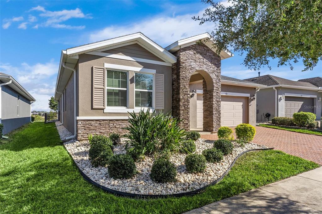 224 Silver Maple Road Groveland, FL 34736 - Photo 3 of 54 front view of a house with a yard
